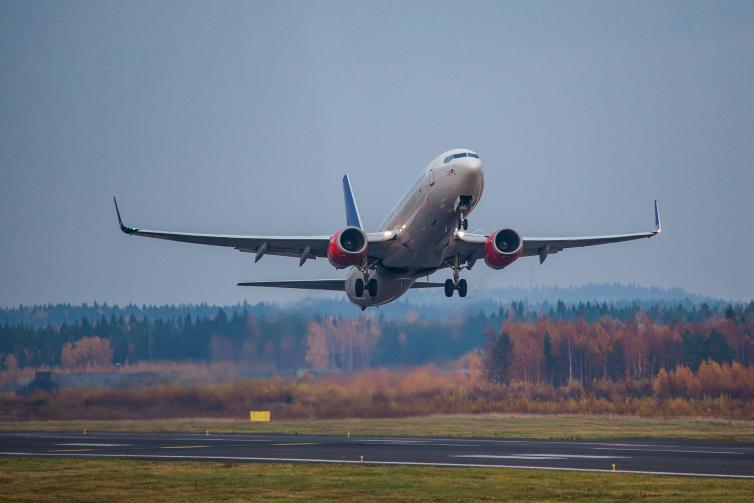 SAS airplane taking off the runway.