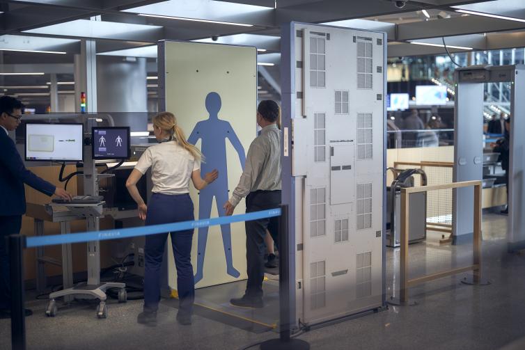 Passenger being security screened.