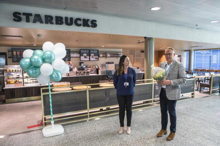 Two people at Starbucks grand opening.