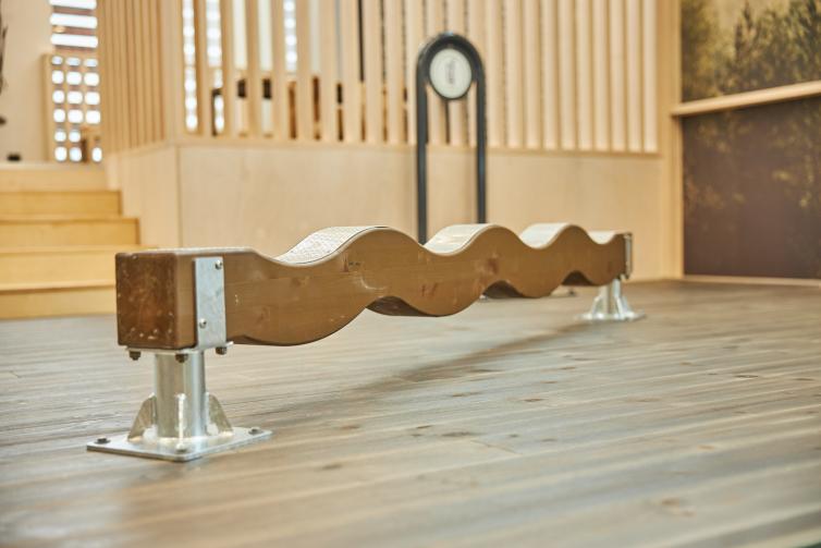 Wooden wavy balance beam at Maja Lounge.