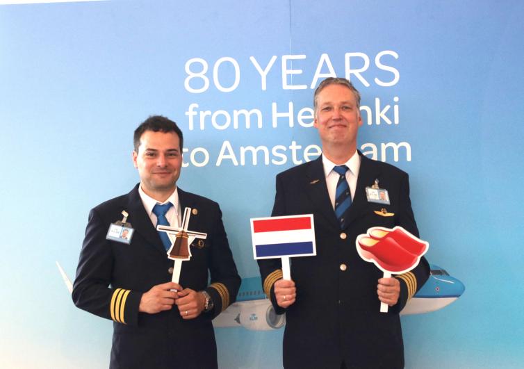 Two KLM airlines pilots posing for pictures at KLM event