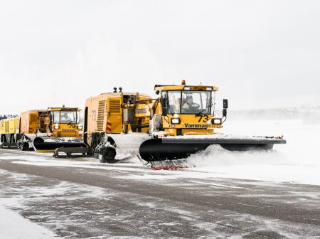 Cleaning snow on runway.