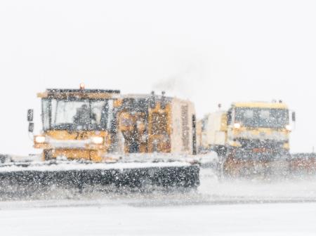 Cleaning snow on runway.