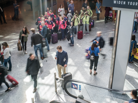Boy in terminal in human bustle.