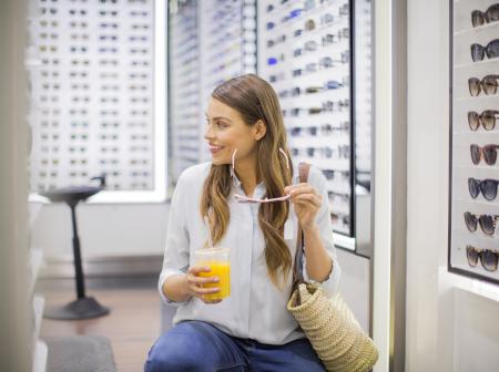 Woman choosing sunglasses.