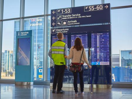 Passenger with disability and assistant.