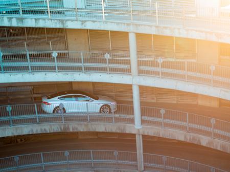 Car is driving in the parking hall