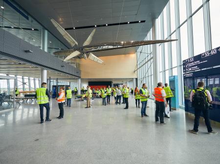 Safety vest wearing staff members on test day at Aukio.