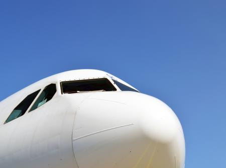 A close-up photo of a white airplane