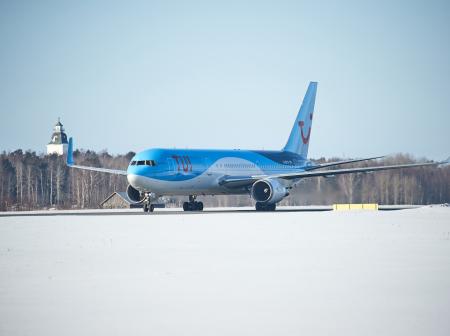 TUI's airplane in a snowy airport