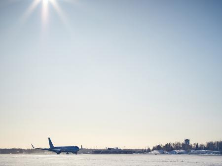 Plane at wintery airport.