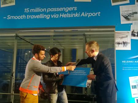 A person interviewing another at airport.