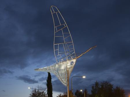 A metallic artwork sculpture outside airport.