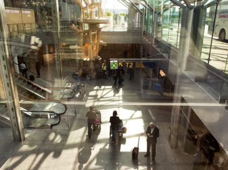 People passing in airport corridors.