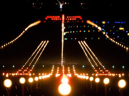 The runway lights during night.
