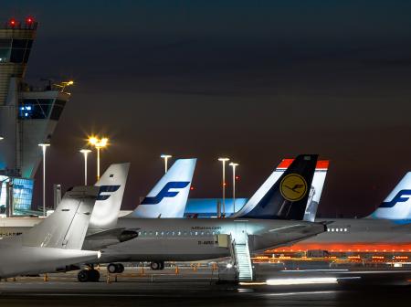 Airplanes at Helsinki Airport at night.