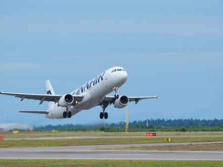 Finnair airplane is taking off runway.