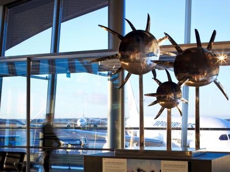 An metallic artwork about sunflowers at airport.
