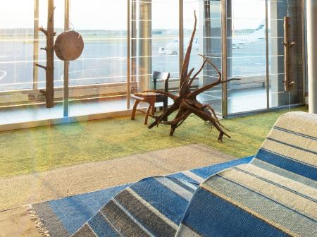 A lounge with wooden furniture.