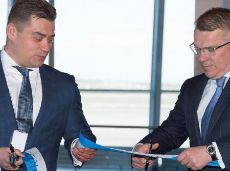 Two men at flight router opening ceremony.