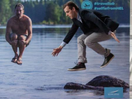 A man jumping into a lake.