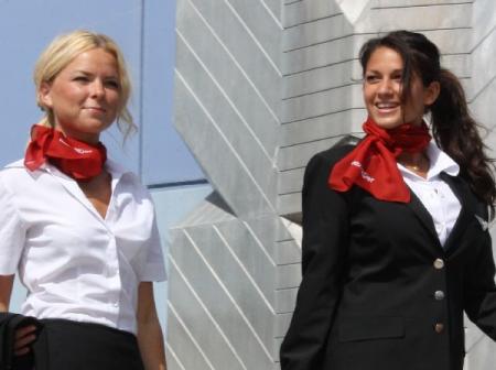 Two flight attendants walking.