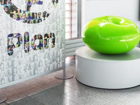 A green fundraising casket.