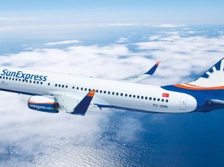 Airplane flying above a sea.