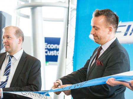 Ceremonial ribbon cutting during Fukuoka route opening ceremony at Helsinki Airport.