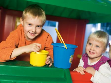 Two childen playing at plaroom.