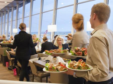 Waiters bringing food to the tables at Pier Zero.