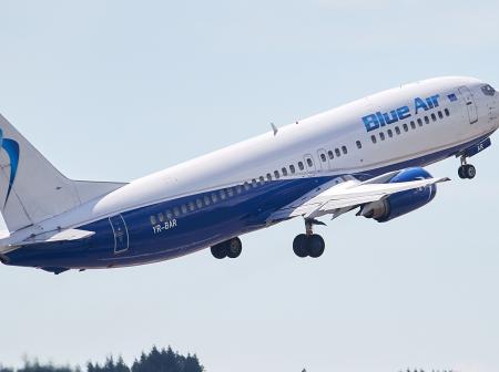 Blue Air airplane taking off.