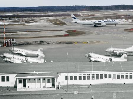 A poster showing old and new airplanes at airport.