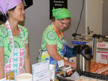 Two women selling baked goods.