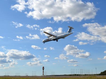 An airplane landing to runway.