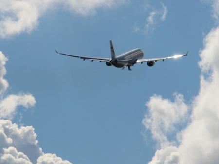 Airplane ascending into sky.