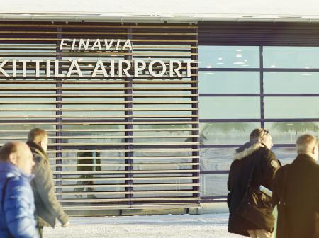 People walking in front of Kittilä airport.