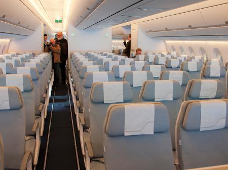 An empty cabin inside an airplane.