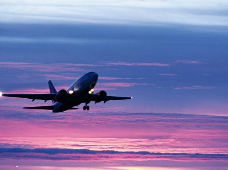 Airplane ascending into sky.