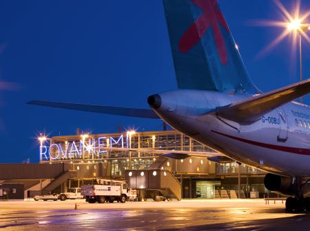 Back wings of an airplane in the night time at Rovaniemi airport.