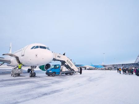 Aeroplane at snowy airport.