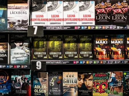 Multiple of books displayed on a shelf.