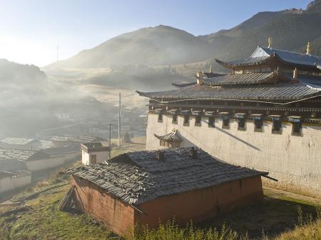 Lama temple in misty morning, Gansu, China.