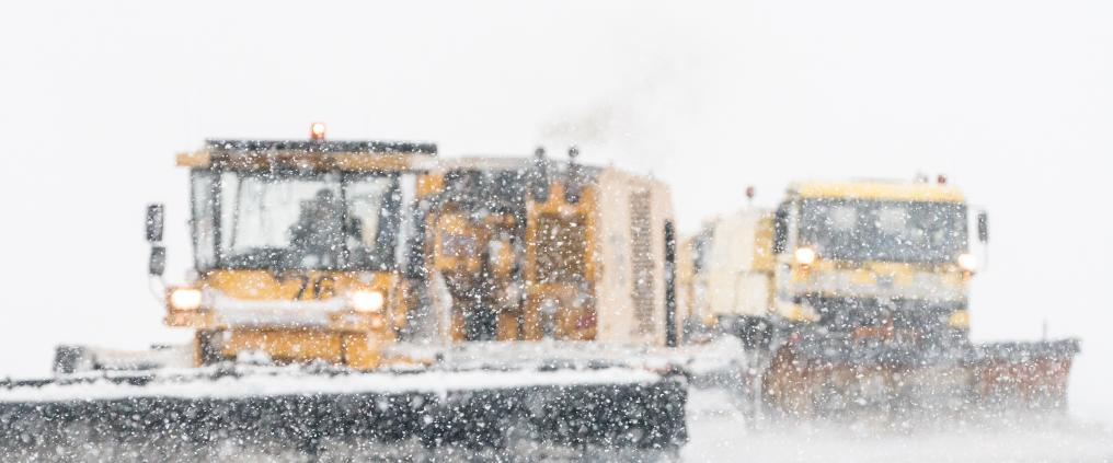 Cleaning snow on runway.