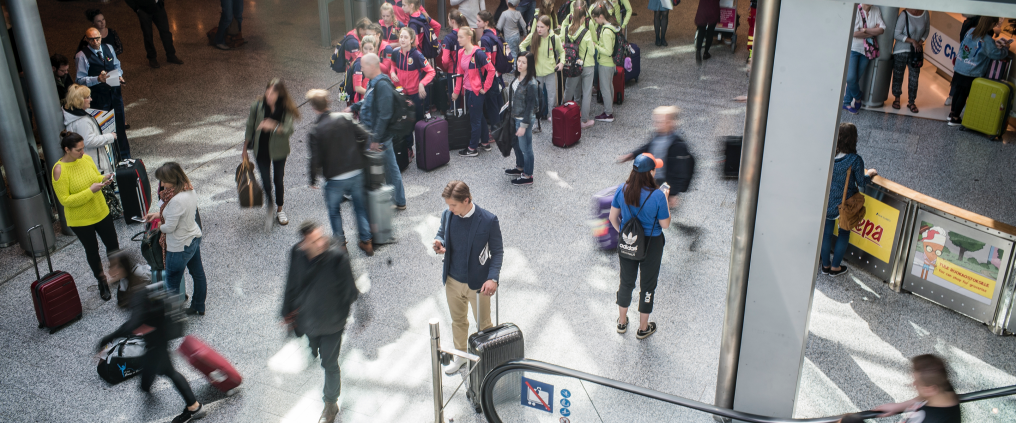 Boy in terminal in human bustle.