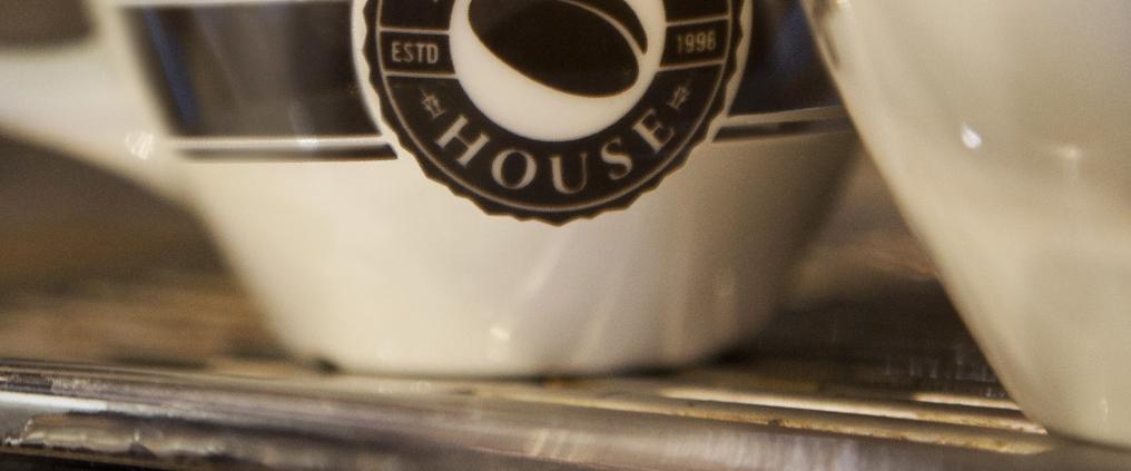 Close up of a coffee mug with Espresso House logo.