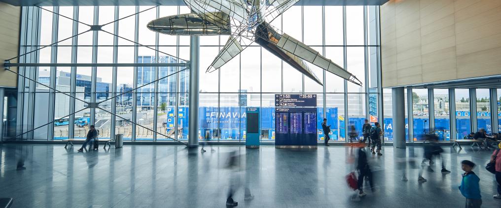 Large art sculpture hanging from the ceiling of Helsinki airport's east wing.