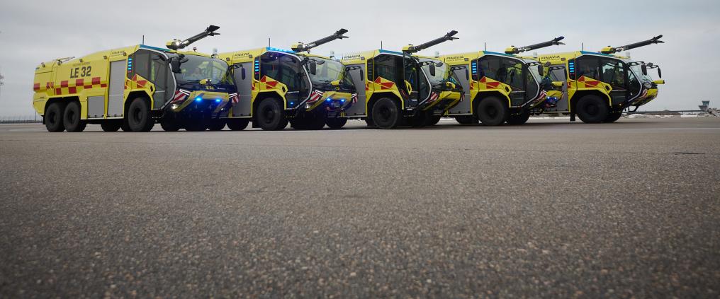Five fire fighting vehicles in a row.