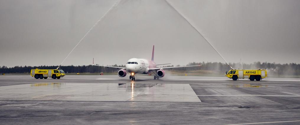 Airplane receiving a water salute.