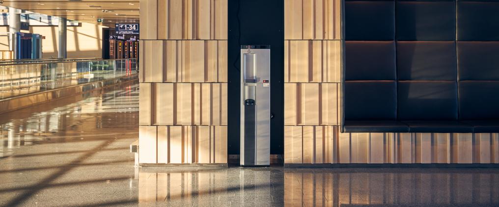 Water automat and 3D wood panel wall.